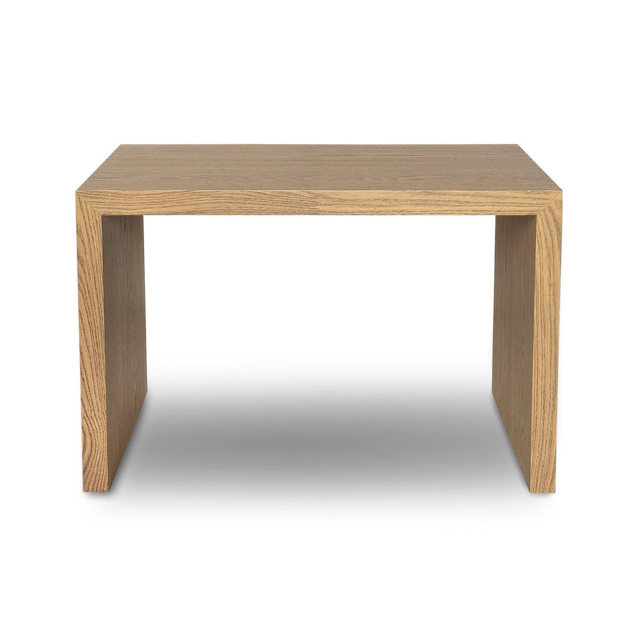 Front view of the Forest coffee ottoman featuring a cream upholstered rectangular bench with a nested blonde oak waterfall table
