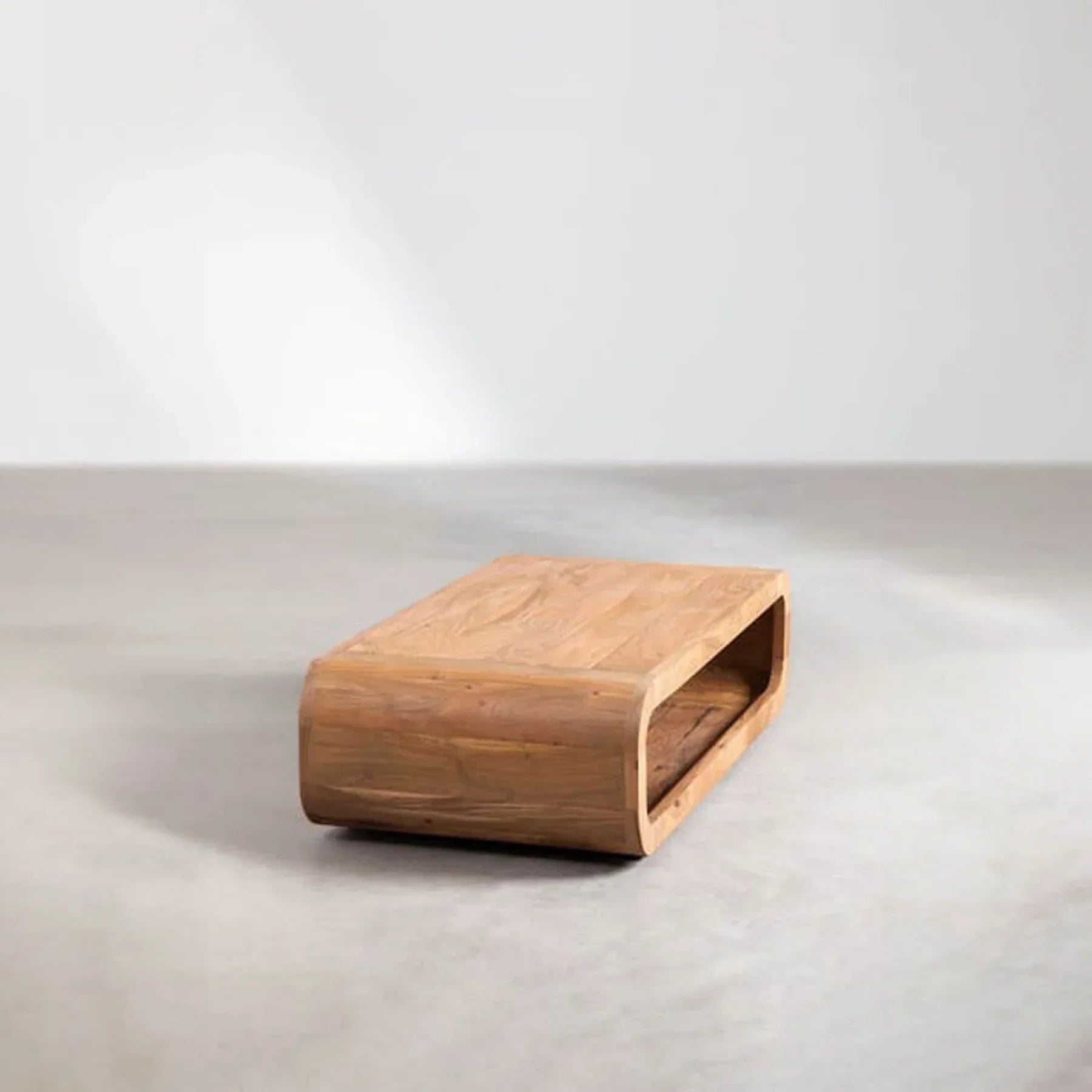 Perspective lifestyle shot showcasing the low-profile design and storage functionality in a gallery-style space
