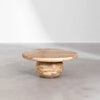 Lifestyle shot of the Form sphere coffee table styled in a minimalist space with a light grey floor