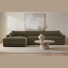 Studio lifestyle shot featuring the brown marble coffee table styled in a contemporary lounge area with a large olive green sectional sofa