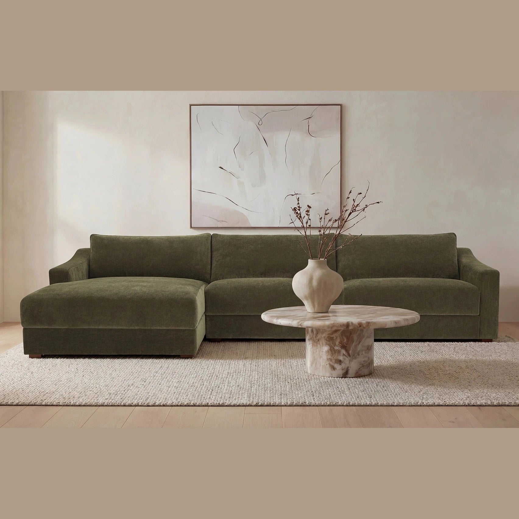 Front view of the Frida round outdoor coffee table featuring a thick brown marble top and a solid cylindrical pedestal base with natural mineral veining