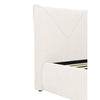 Macro shot highlighting the precision of the decorative V-stitched pattern on the cream upholstered headboard
