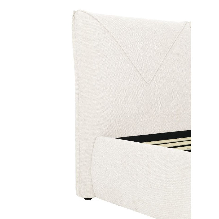 Front view of the Aici storage bed featuring a cream fabric finish and a unique V-shaped geometric stitched headboard
