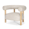 Angled view of Gianna accent chair with wood legs