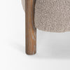 Angled view of Gianna accent chair with dark wood frame
