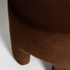 Close-up detail shot highlighting the soft matte texture and deep warm tone of the chestnut velvet upholstery