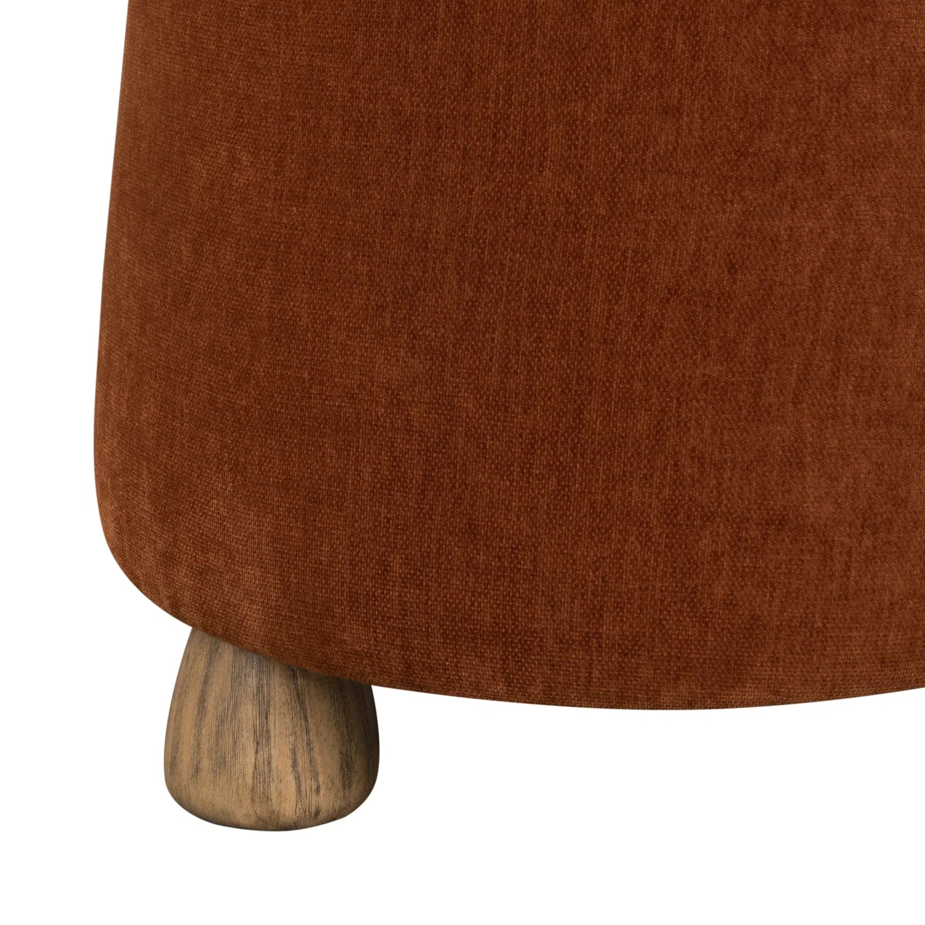 Front view of the Giselle round ottoman featuring burnt orange textured upholstery and four tapered light wood feet