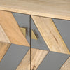 Macro shot of the contemporary gold triangular hardware set against a matte grey drawer front