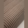 Close-up detail of the grey-brown corduroy fabric grain used on the Rigo collection