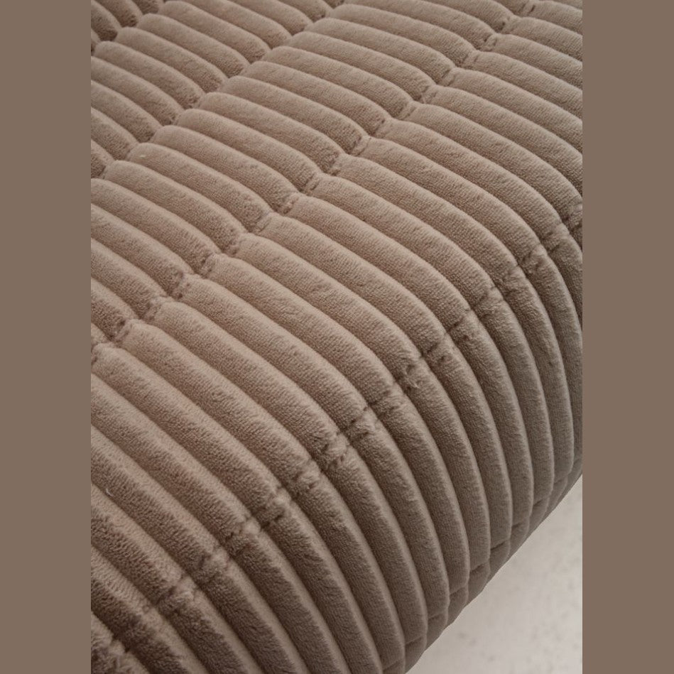 Large front view of the Rigo accent chair in beige corduroy fabric with a low-profile channeled design.