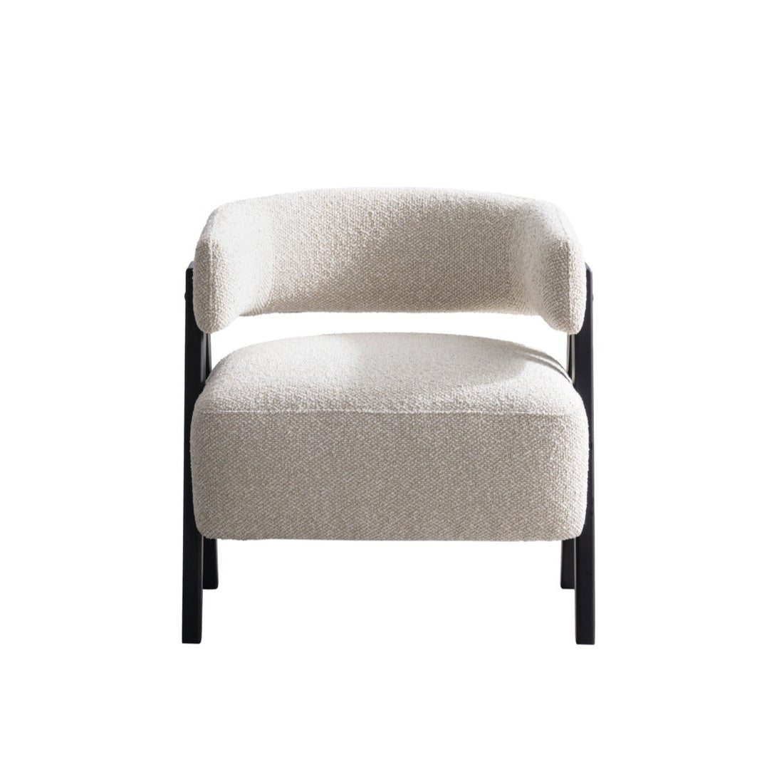 Front view of the Gunnar Accent Chair featuring white bouclé fabric and black A-frame wooden legs.