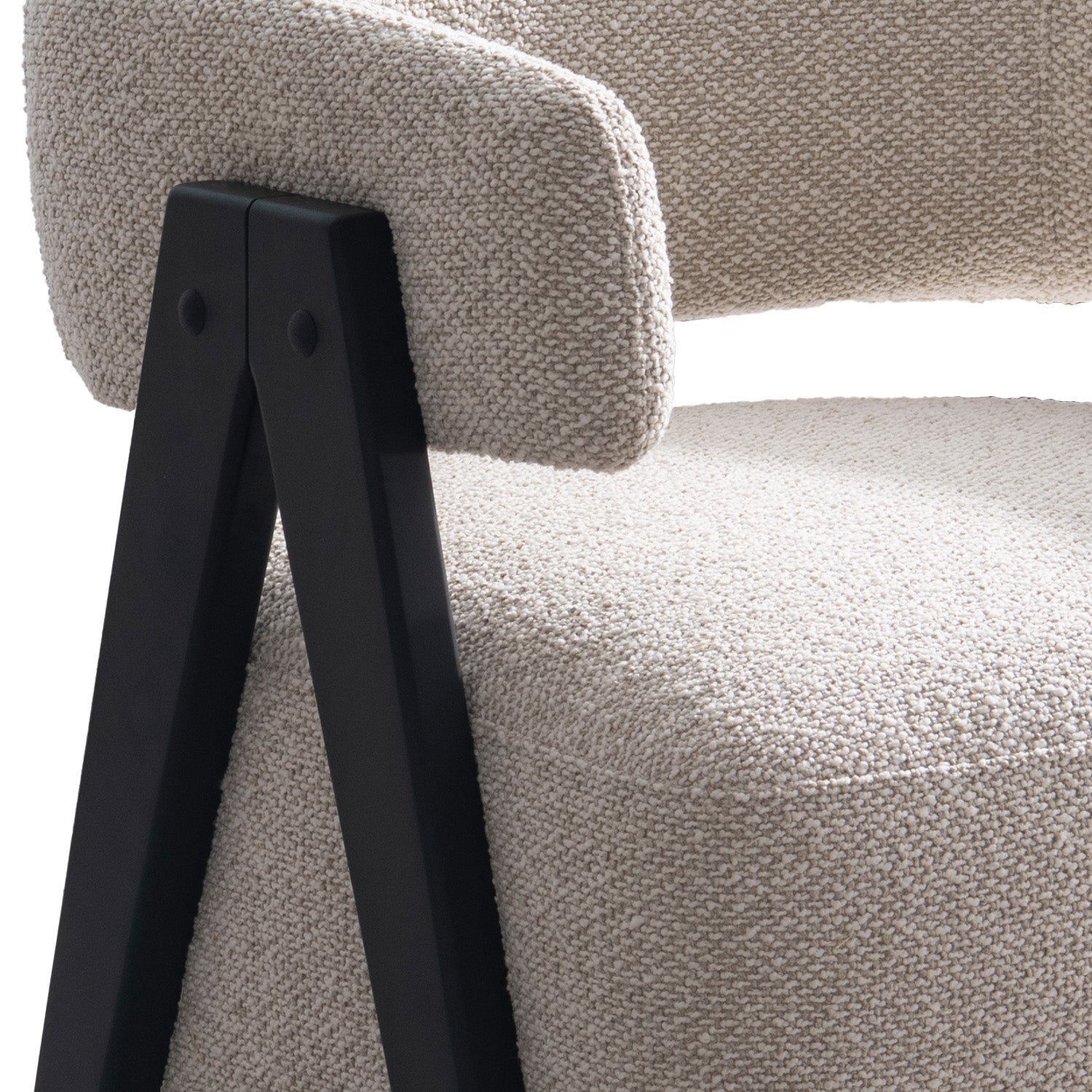 Front view of the Gunnar Accent Chair featuring white bouclé fabric and black A-frame wooden legs.