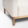 Close-up of Hale cream sofa corner and wooden leg