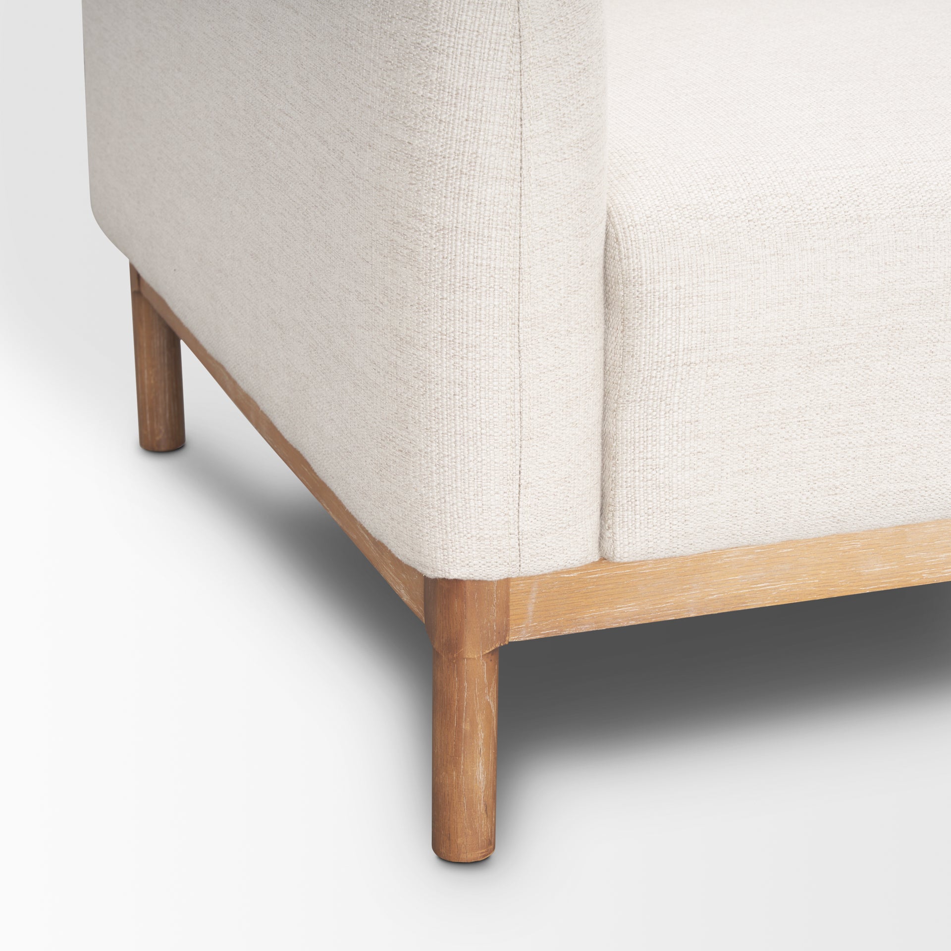 Front view of Hale cream sofa with light wood base