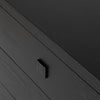 Macro detail shot focusing on the low-profile black square handle and the subtle natural wood grain of the oak finish