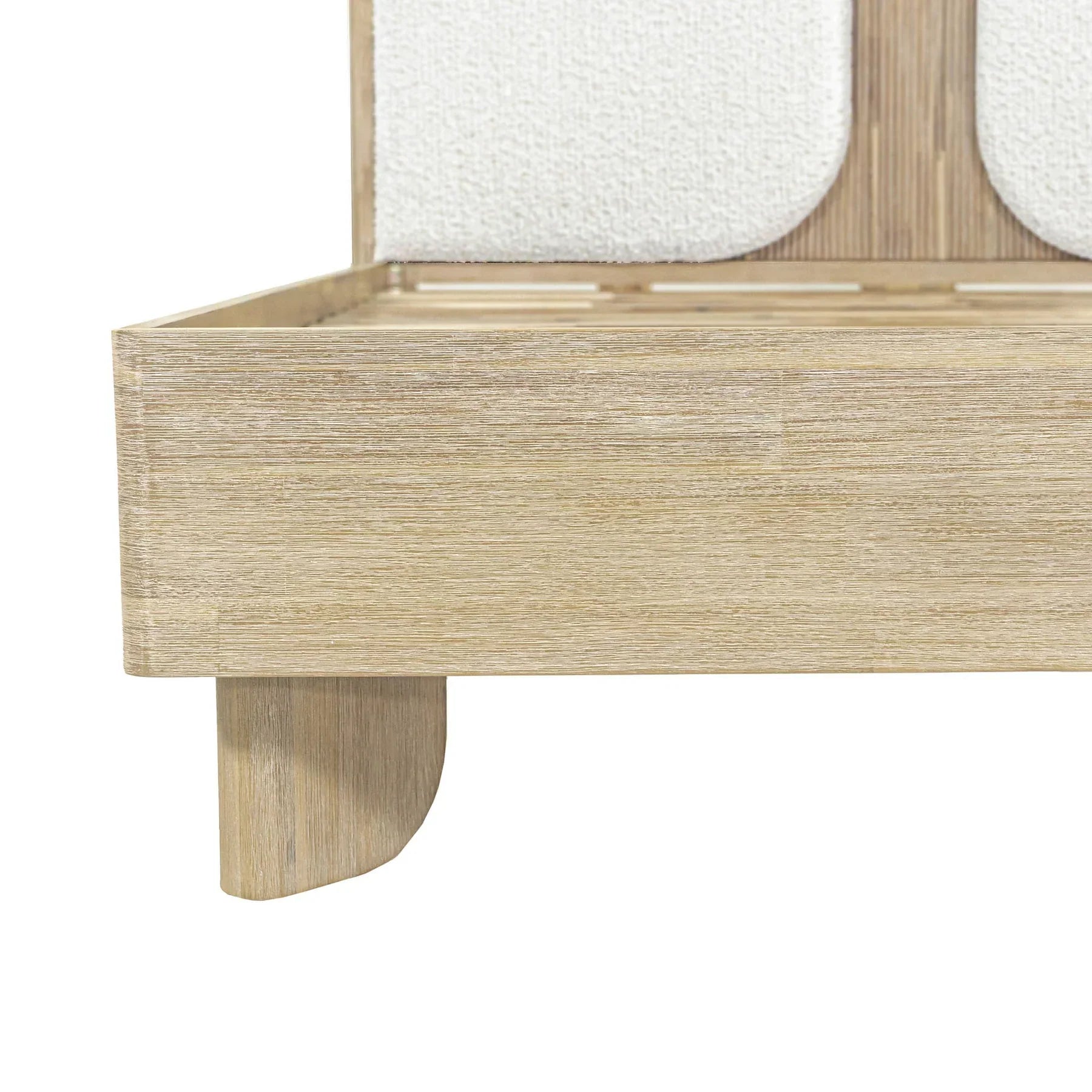 Front view of the Haru platform bed featuring a light driftwood frame and twin white bouclé upholstered headboard inserts