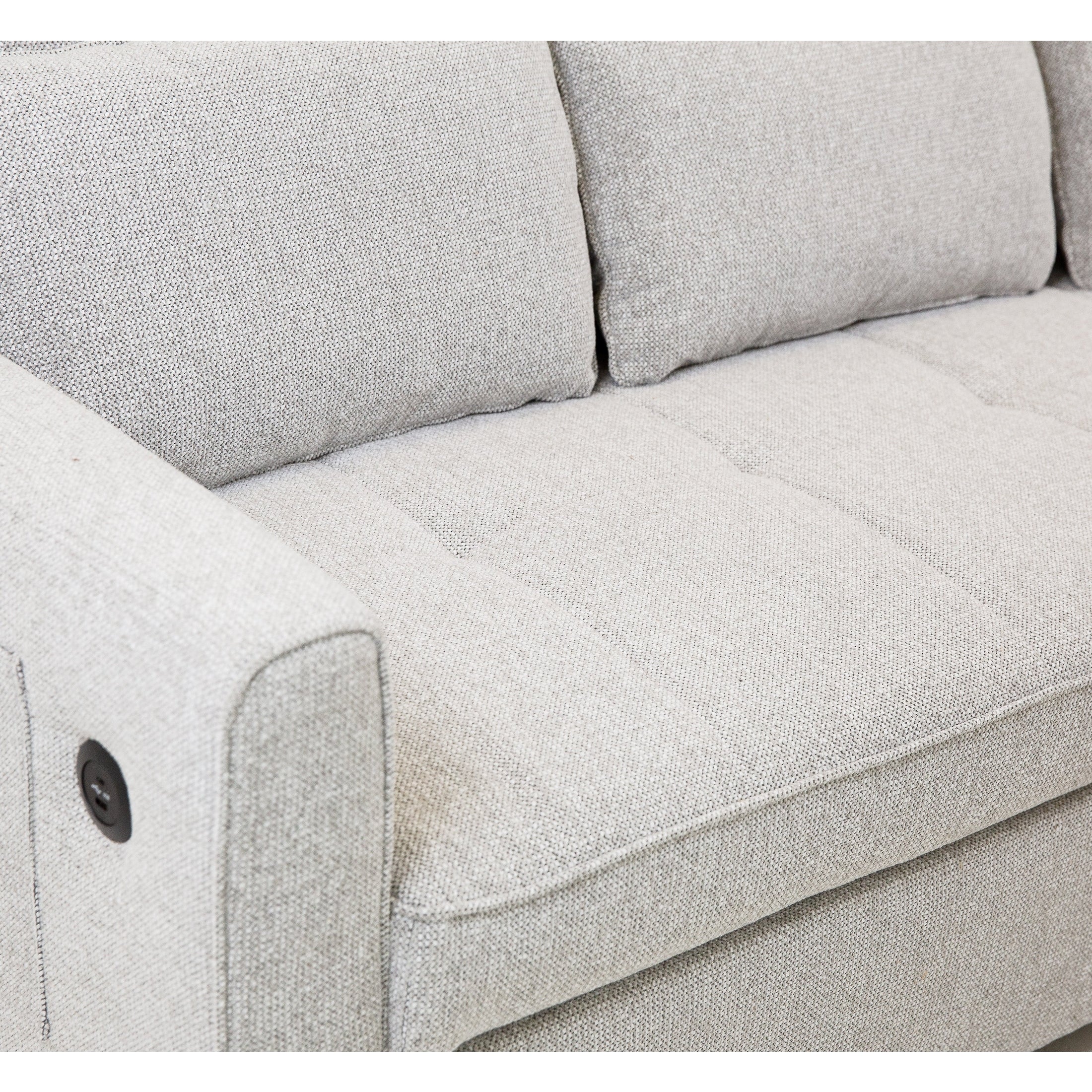 Front view of the Hedal Sofa Sectional Sleeper in cream textured fabric with matching throw pillows