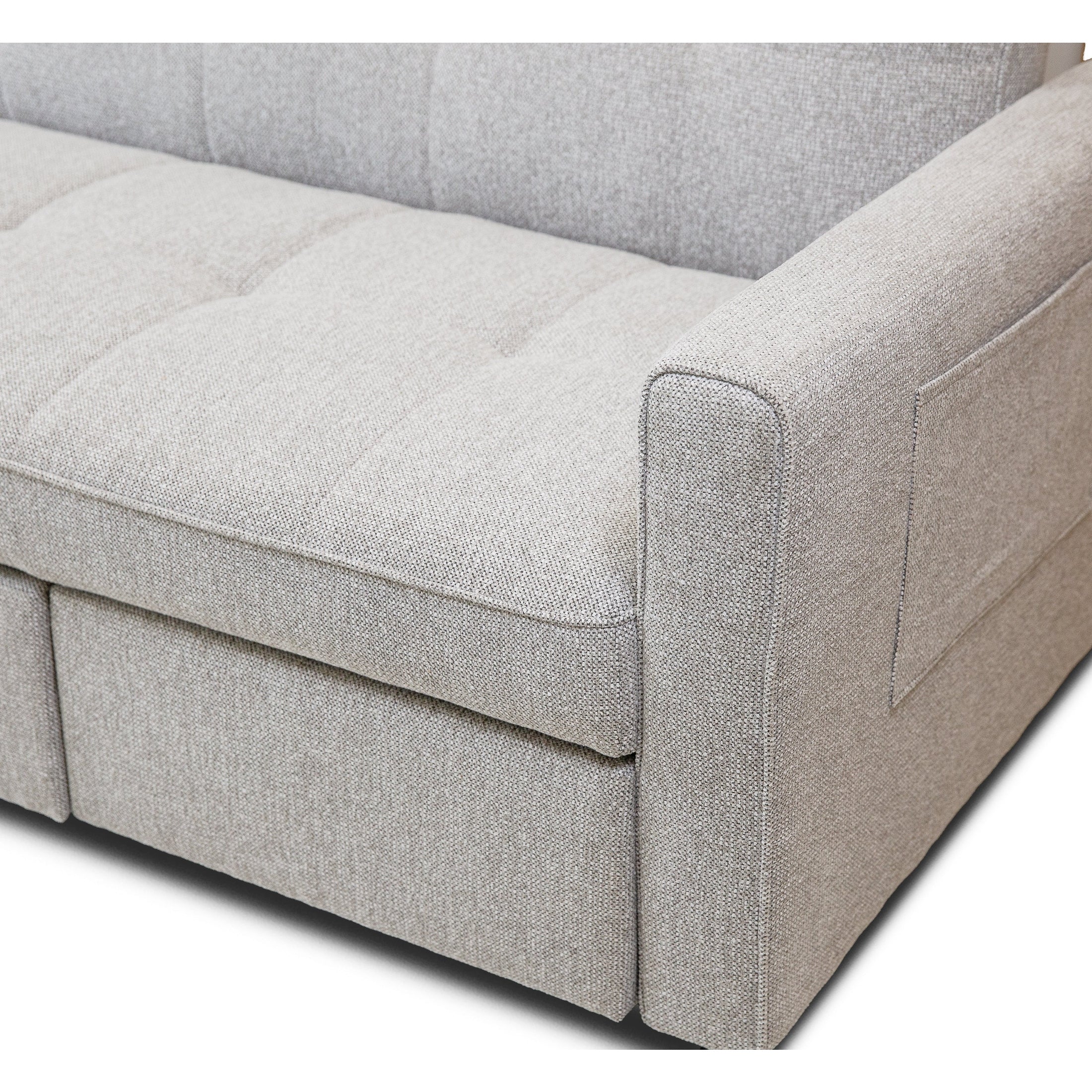 Front view of the Hedal Sofa Sectional Sleeper in cream textured fabric with matching throw pillows