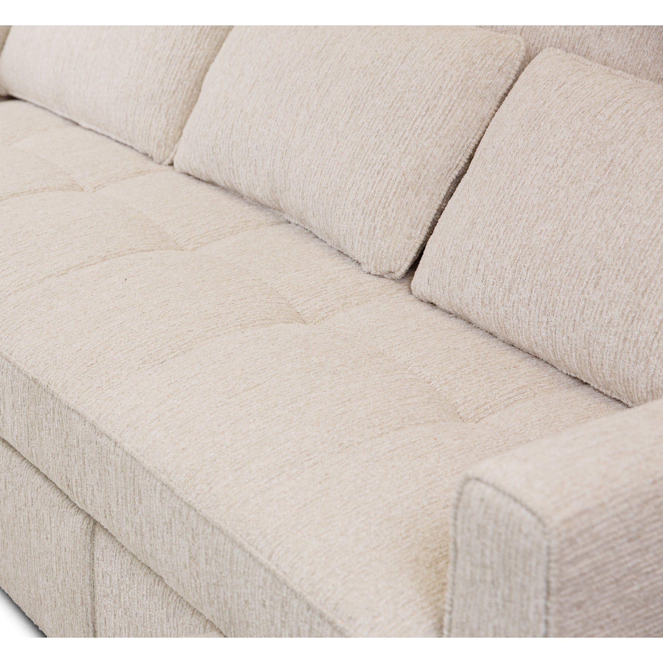 Front view of the Hedal Sofa Sectional Sleeper in cream textured fabric with matching throw pillows