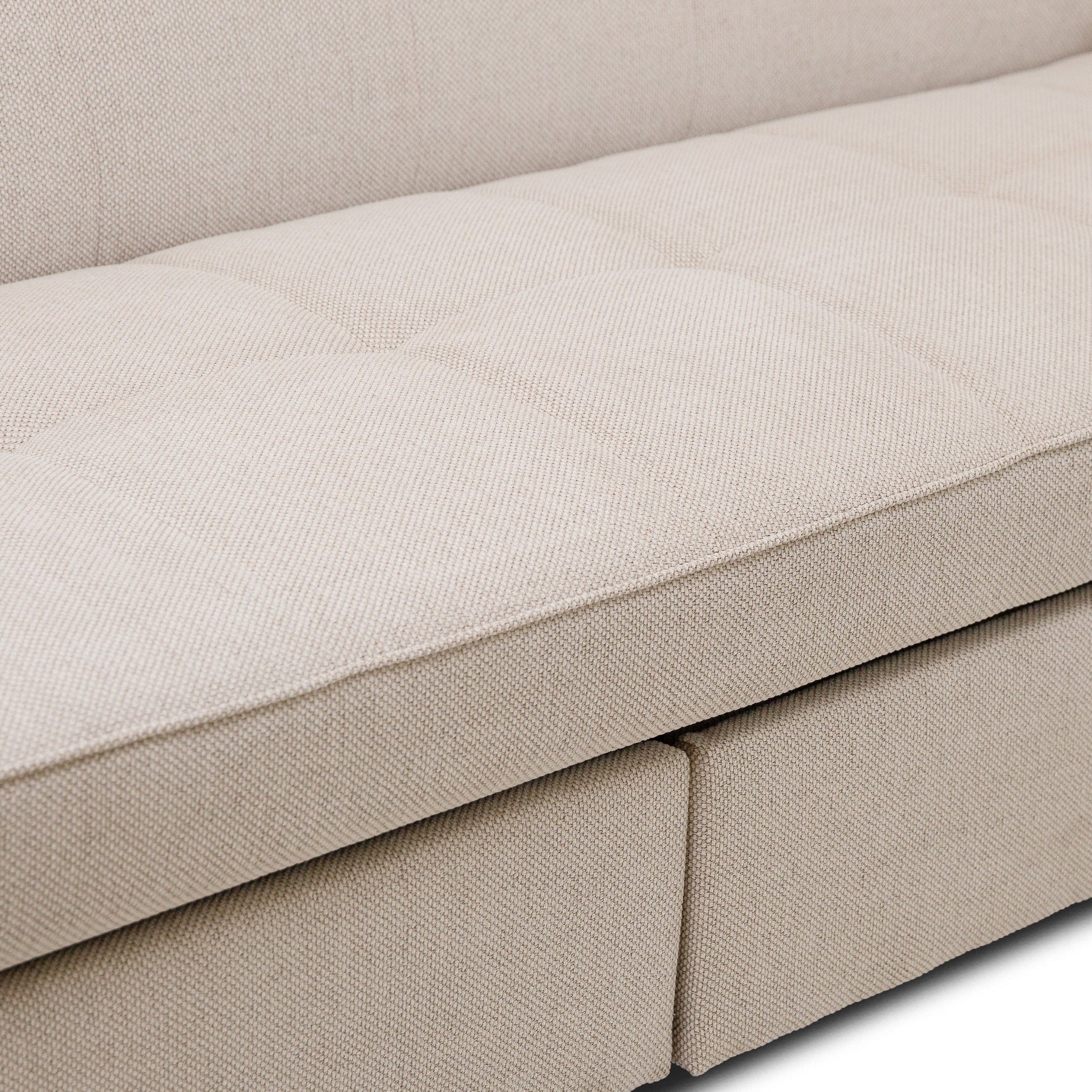 Front view of the Hedal Sofa Sectional Sleeper in cream textured fabric with matching throw pillows