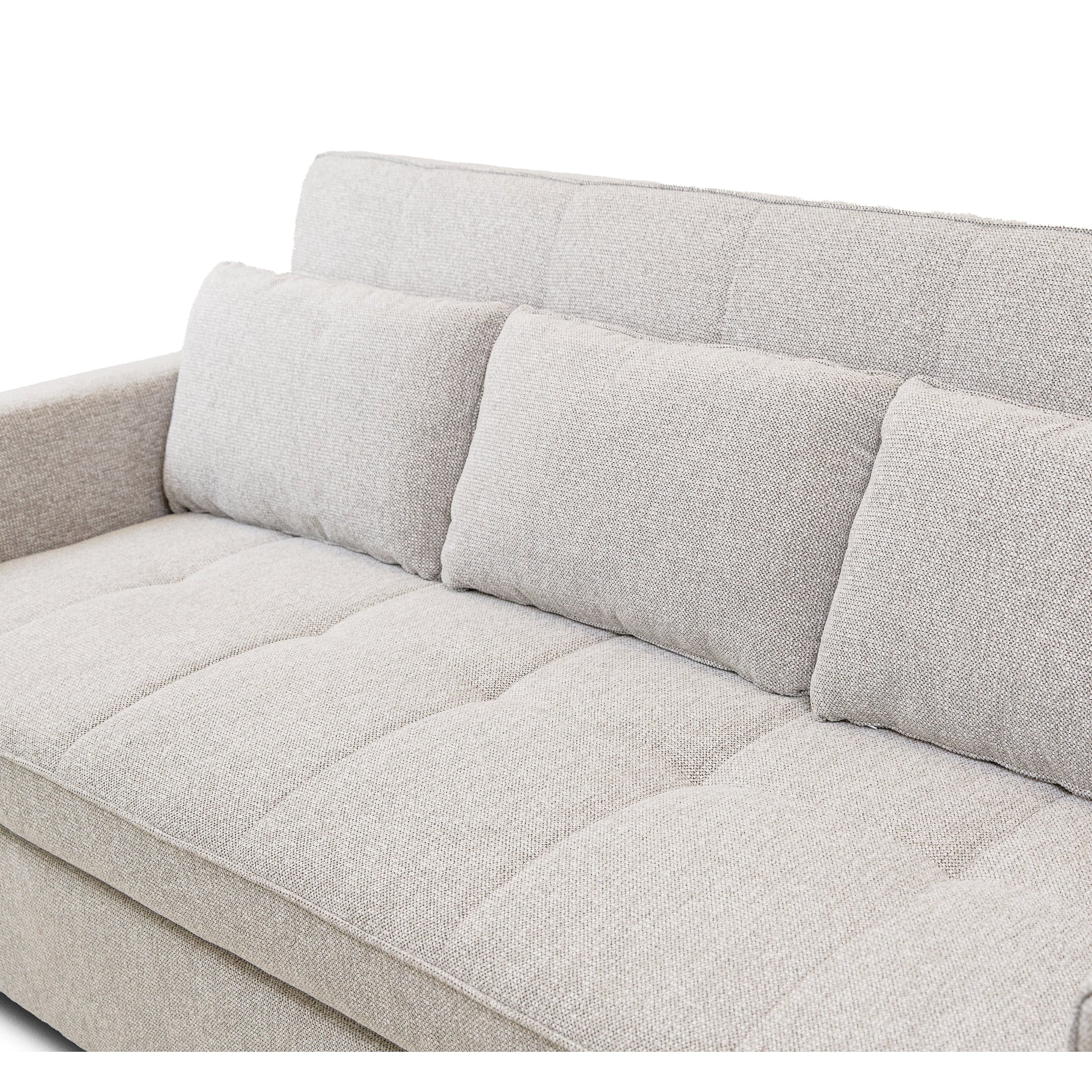 Front view of the Hedal Sofa Sectional Sleeper in cream textured fabric with matching throw pillows