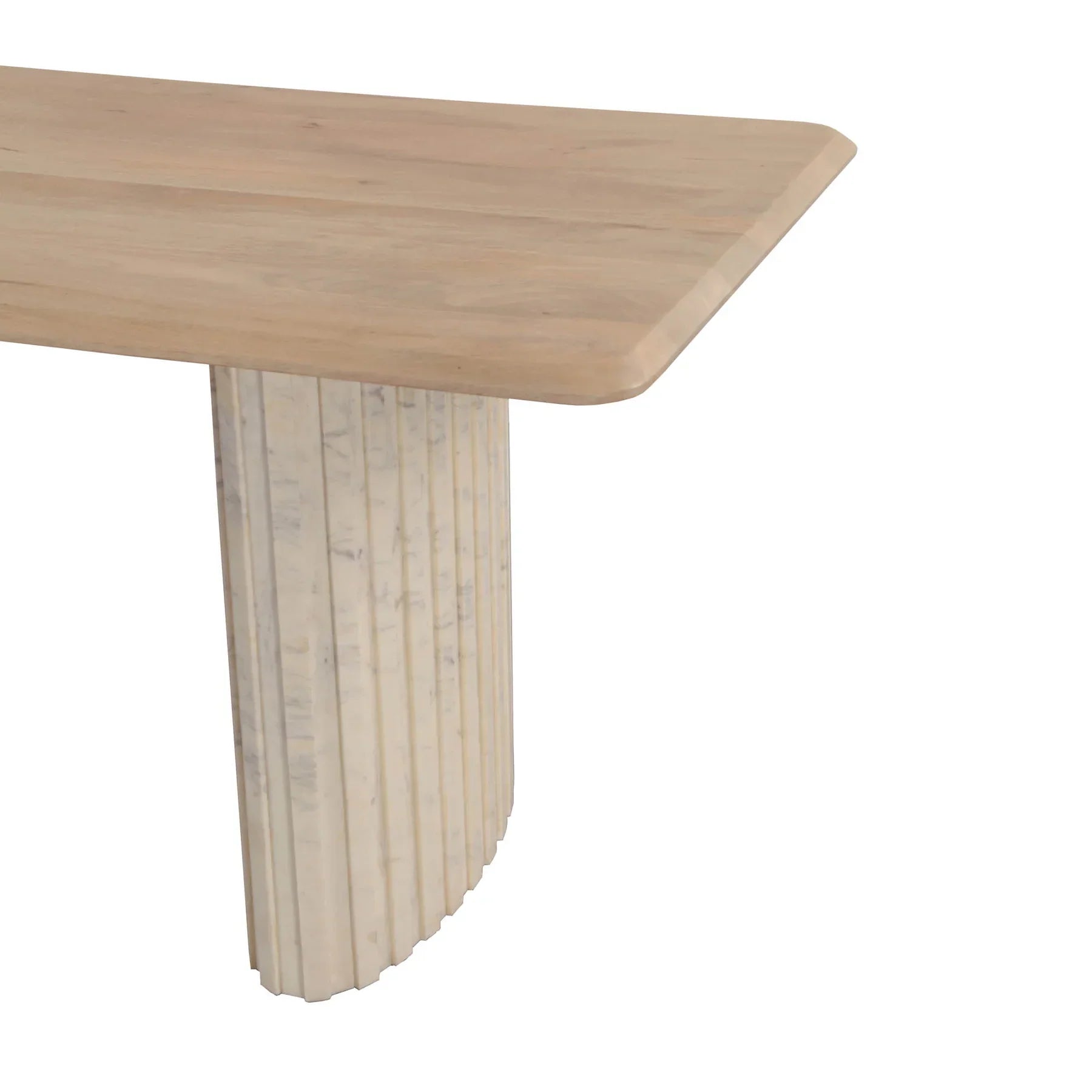 Front view of the Hedron dining table in a natural oak finish featuring rounded corners and two thick ribbed pedestal legs