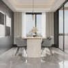 Studio lifestyle shot featuring the Hedron table styled with four grey upholstered chairs in a bright contemporary space