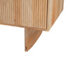 Detailed view of the unique curved wooden leg base showcasing the organic grain and sturdy support