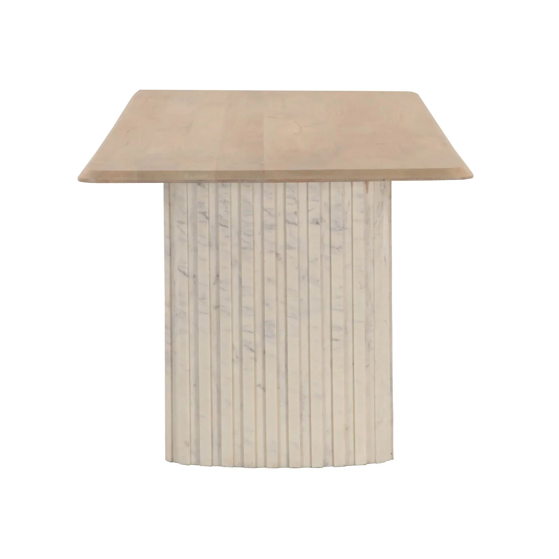 Front view of the Hedron dining table in a natural oak finish featuring rounded corners and two thick ribbed pedestal legs