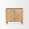 Front view of the Heera accent cabinet featuring a light brown wood finish and a decorative carved diamond motif on the double doors