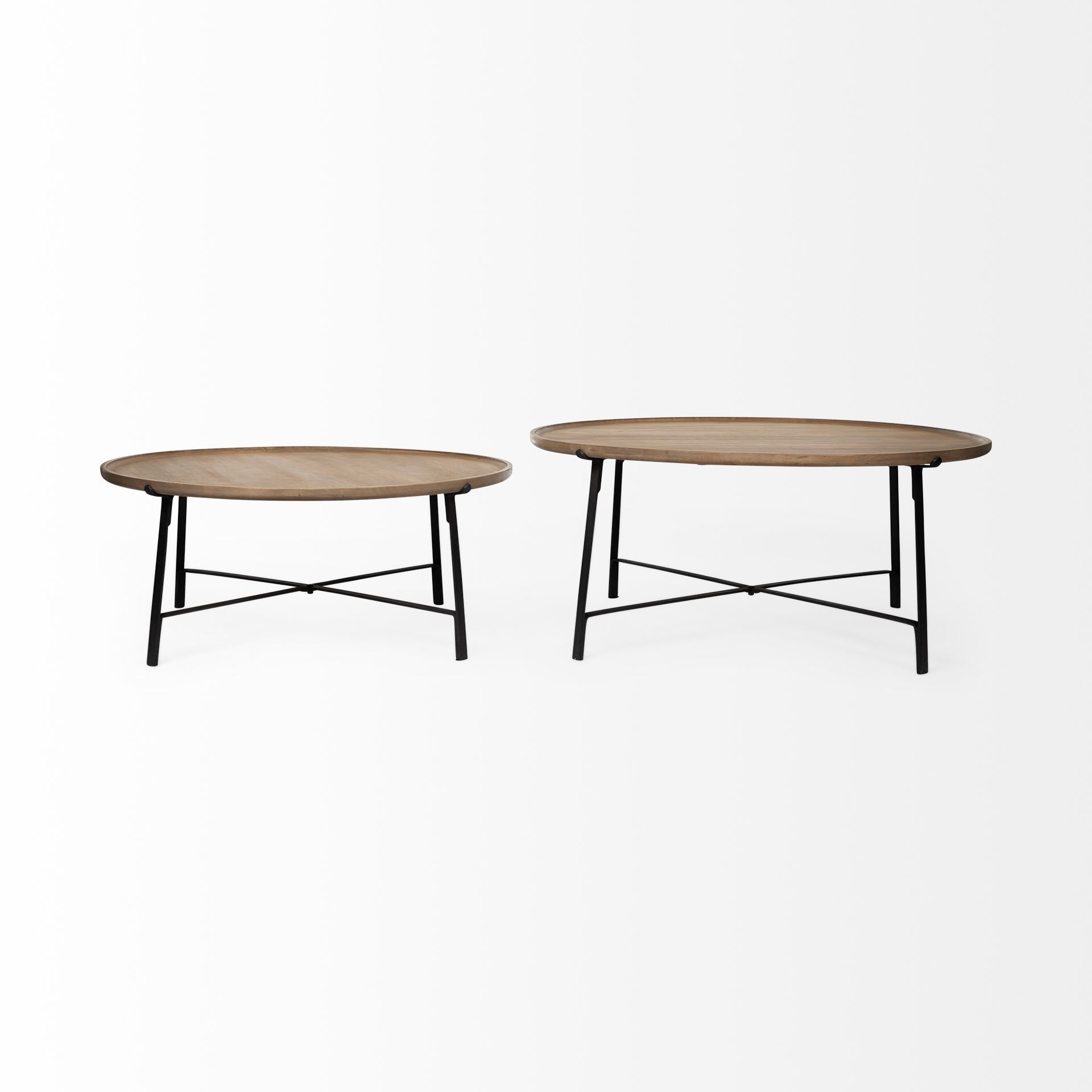 Product shot showing the two circular wood tables side-by-side to highlight the graduated heights and matching industrial metal frames