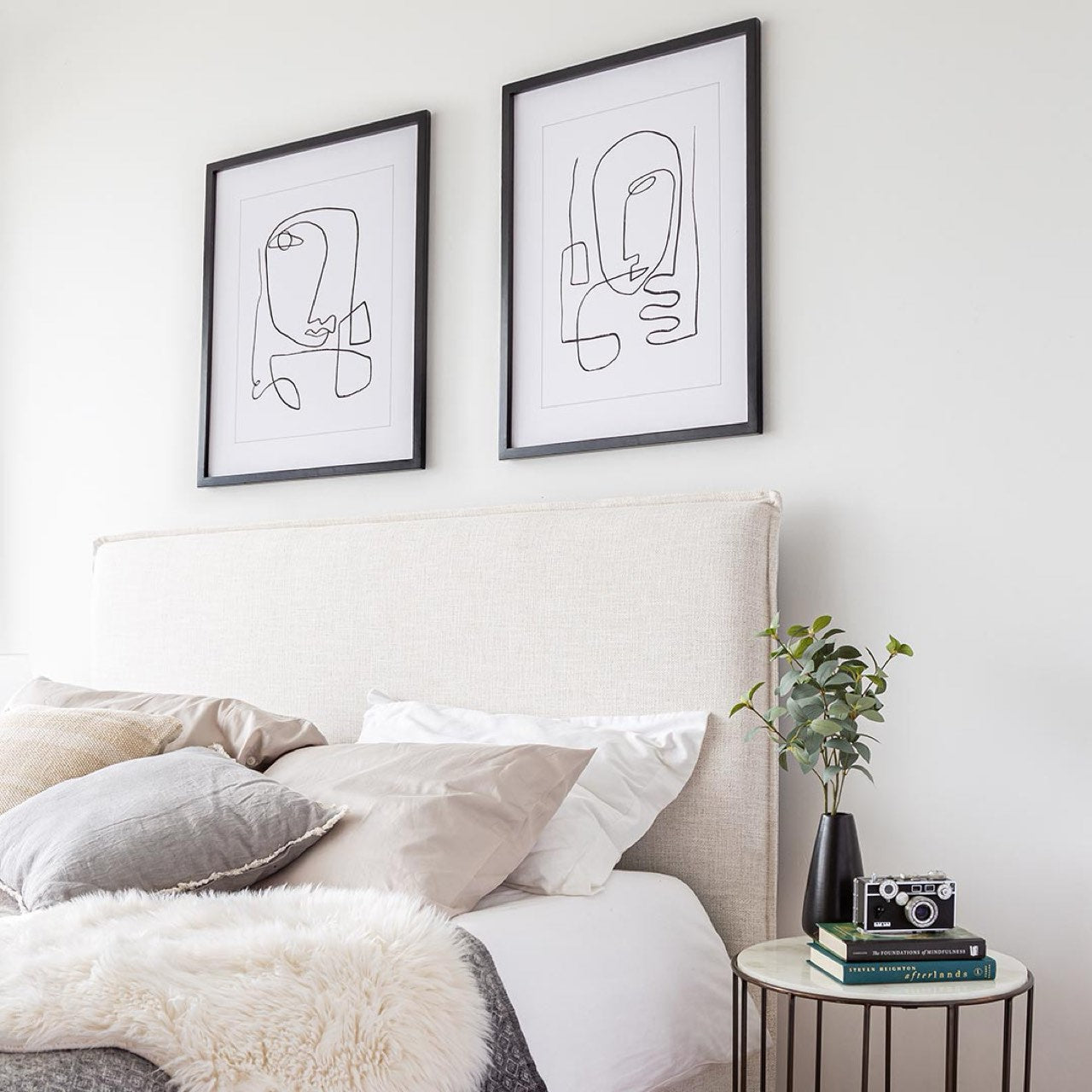 Front view highlighting the soft textured upholstery and the clean architectural lines of the bed frame
