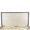 Close-up shot focusing on the natural wood grain of the horizontal oak panels within the black metal headboard frame