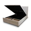 Perspective view of the bed with the lift mechanism raised to reveal integrated storage compartments