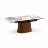 Three-quarter perspective view highlighting the unique tapered wood pedestal base and the slim profile of the ceramic tabletop