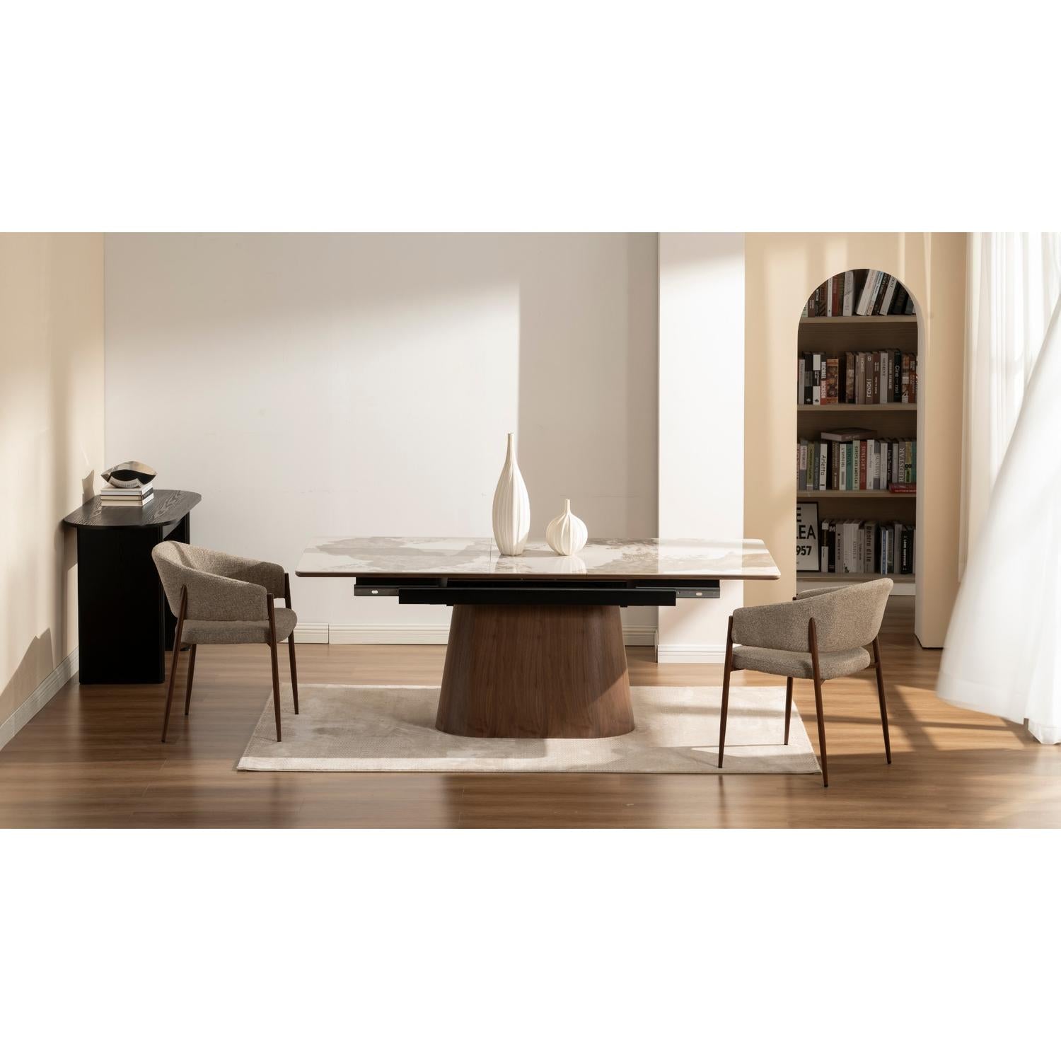 Front view of the Hyld extendable dining table featuring a white patterned ceramic top and a substantial walnut-finished wood pedestal base