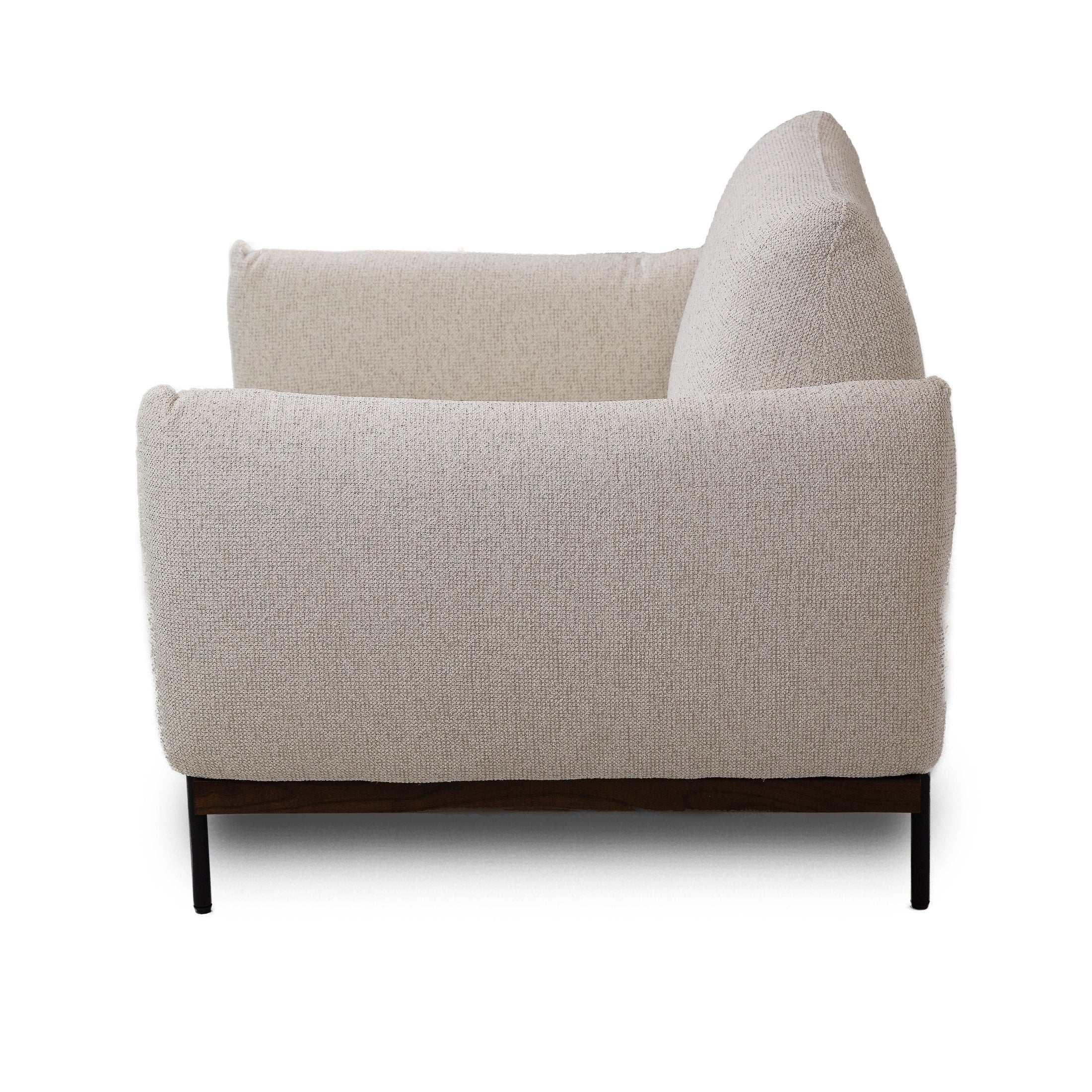 Front view of the Idony Accent Chair in off-white textured bouclé with a dark wood frame and black metal legs