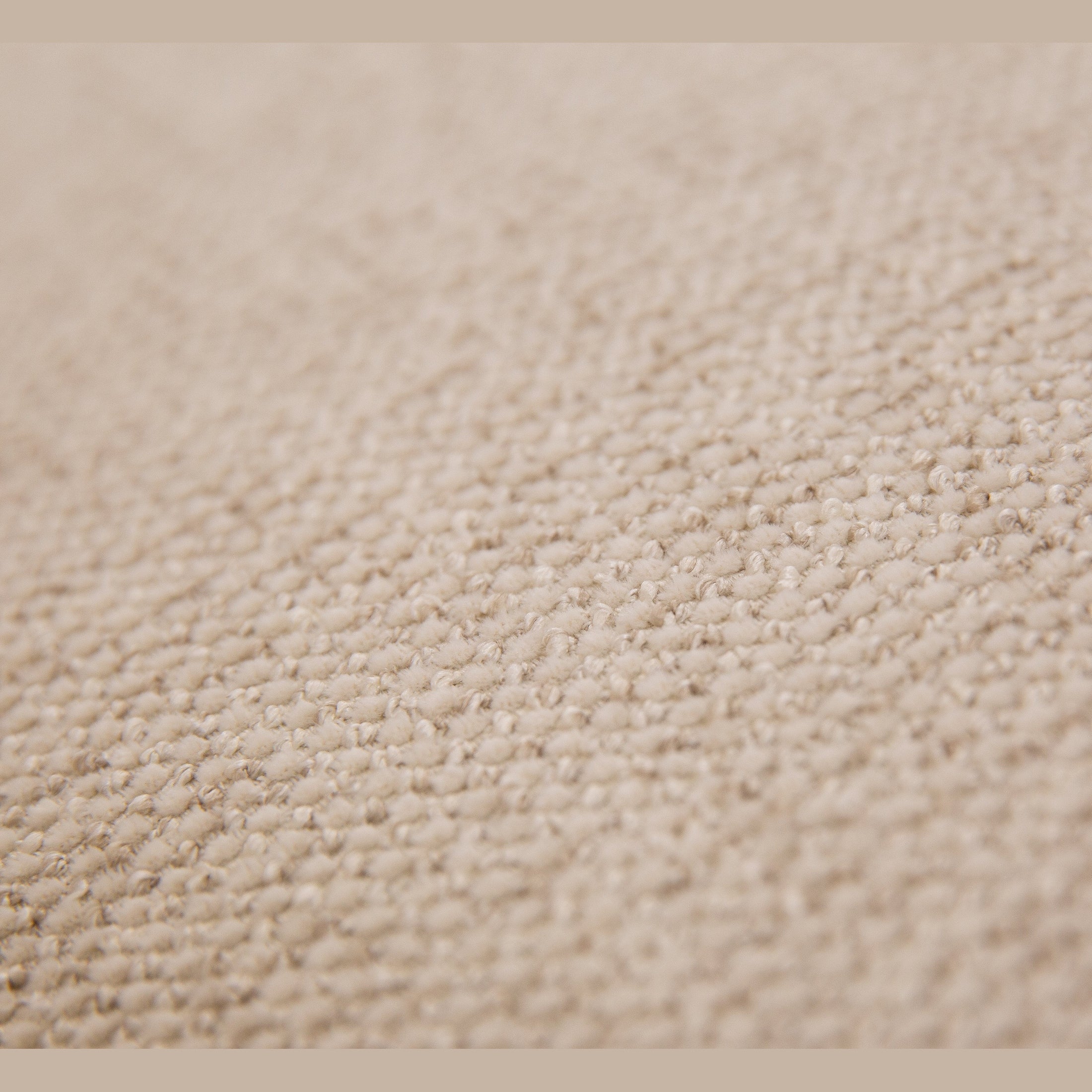 Straight front view of the Idony Loveseat in beige boucle fabric with slim black legs