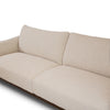 Close-up detail of Idony beige fabric sofa backrest and seat cushions with curved design and wooden base