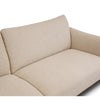 Close-up of Idony sofa in beige textured fabric showing curved backrest and deep seat cushion detail