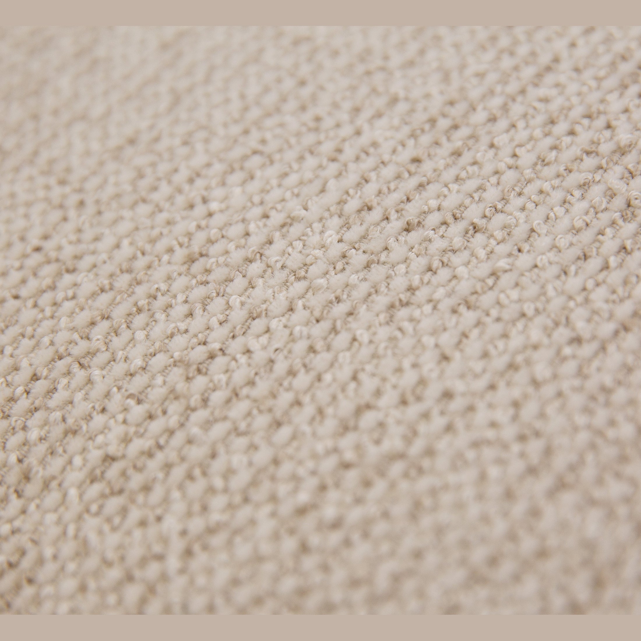 Close-up of Idony sofa beige boucle textured upholstery fabric detail