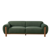 Front view of the Idun sofa in forest green velvet with natural wood frame
