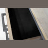 Close-up view of an open drawer highlighting the protective black felt lining and smooth internal construction
