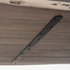 Close-up shot of the table's underside showing the heavy-duty black metal reinforcement brackets for maximum structural stability