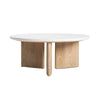 Perspective shot highlighting the smooth rounded edges of the seashell finish tabletop and the unique three-panel wood base