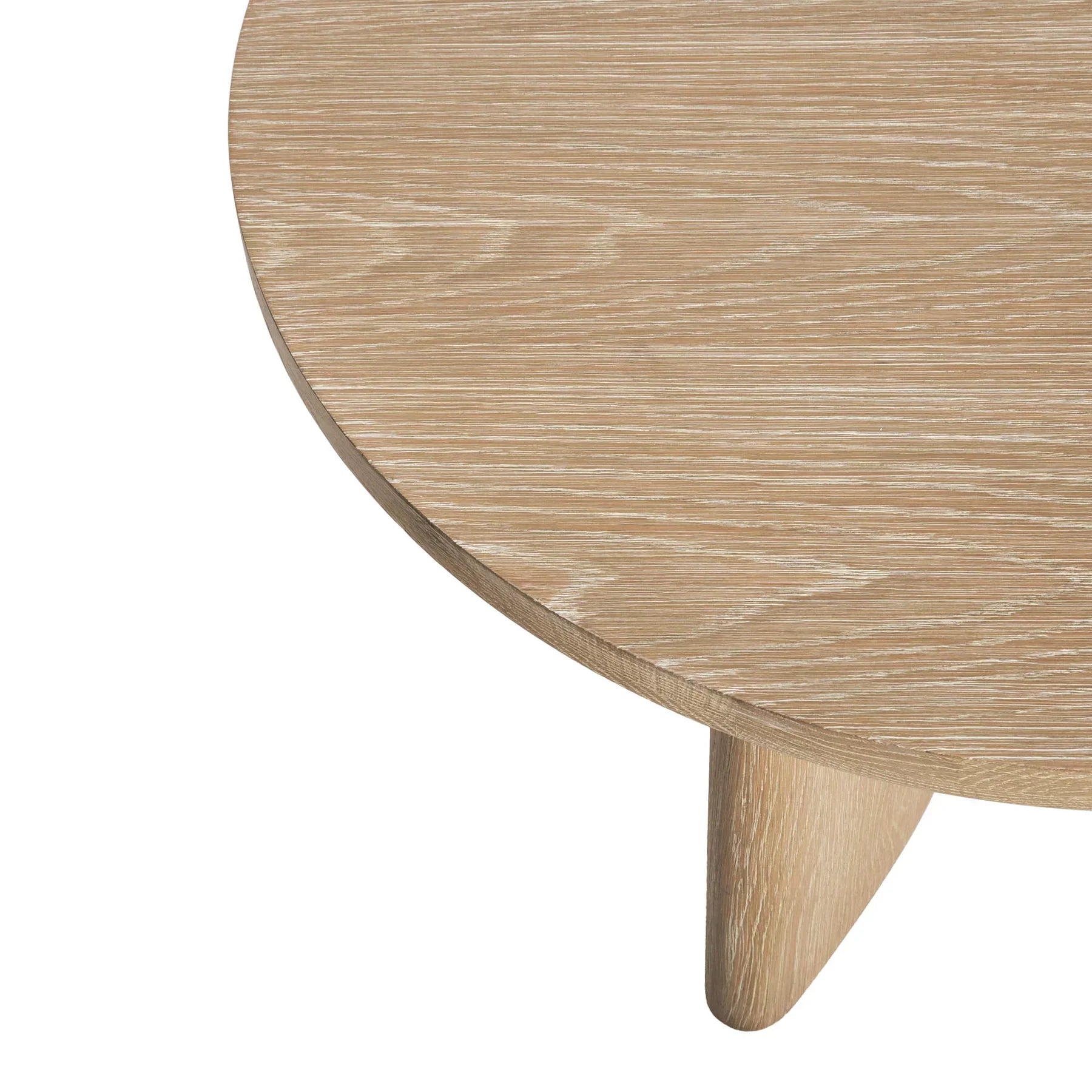 Front view of the Infinity coffee table featuring a circular light oak tabletop and a unique sculptural base with three architectural wood panels