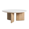 Front view of the Infinity coffee table featuring a circular white terrazzo-style seashell finish top on an architectural light oak wood base
