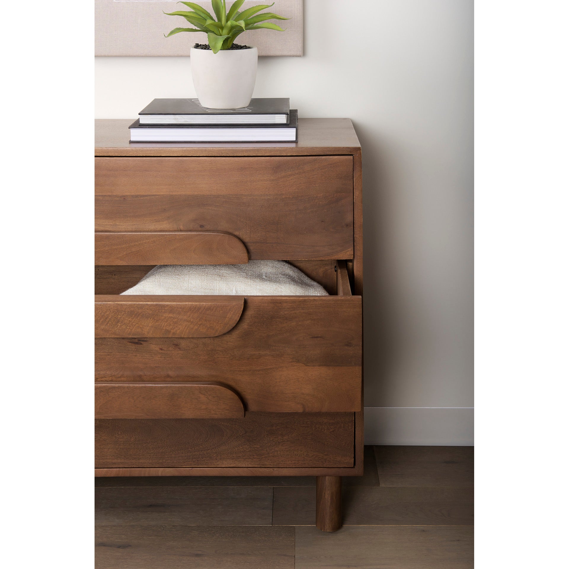 Front view of the Astrid 3-drawer cabinet featuring a warm walnut finish on solid wood with unique integrated oval-shaped drawer pulls