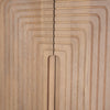 Macro shot highlighting the seamless integration of the vertical fluting that acts as a concealed door pull