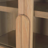 Macro shot highlighting the elegant elongated wood door handle integrated into the glass frame